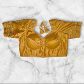golden colour semi silk blouse with embroidery work