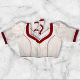 it is a hakoba blouse puff sleeves with red colour frill