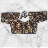 it is a sabyasachi cut katan banarasi black colour golden floral work blouse